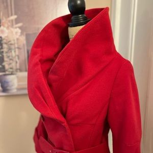 Fire engine red short Jackie O. jacket with 3/4 length sleeves and belt.